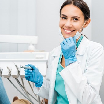 Dentist smiling at patient's dental exam