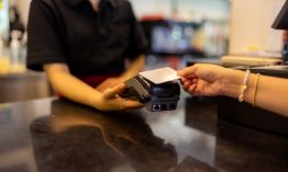 Handing team member a credit card