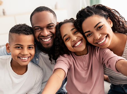 Family with two children smiling