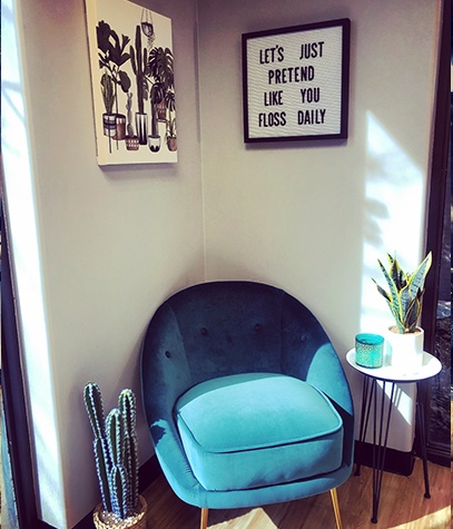 Blue armchair in dental exam area