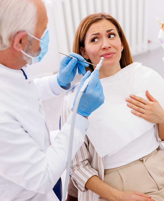 Nervous female patient about to have teeth cleaned